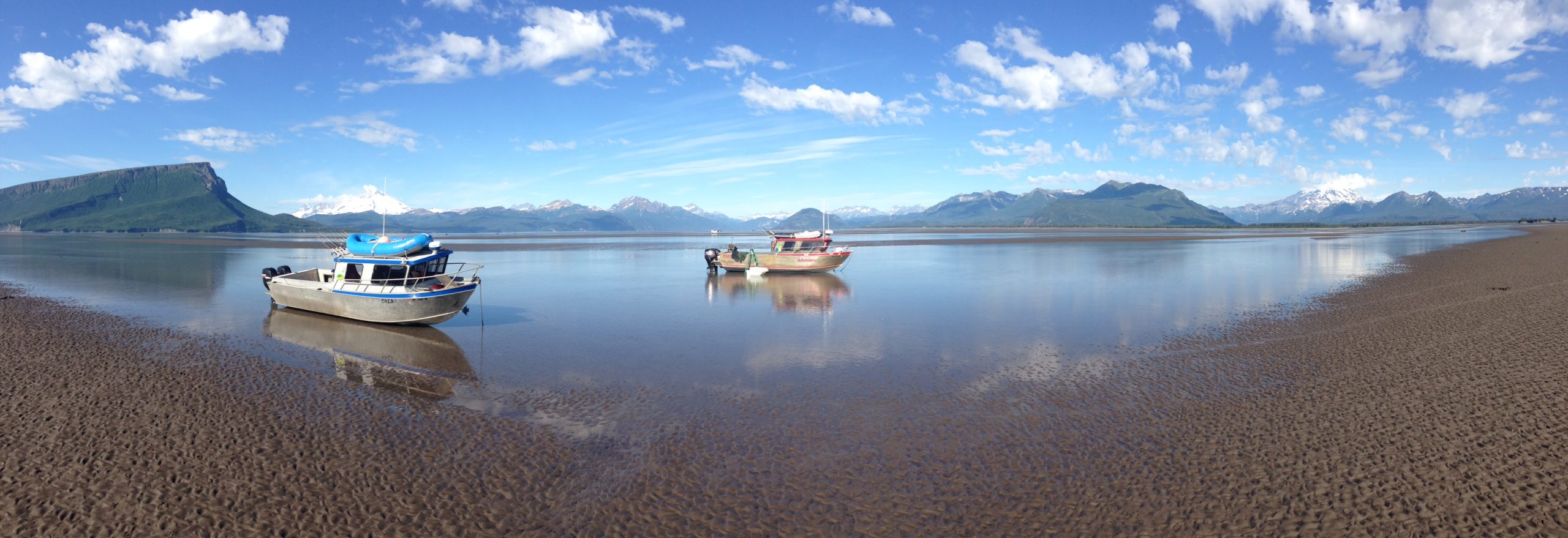 Panorama of two of our boats near shore