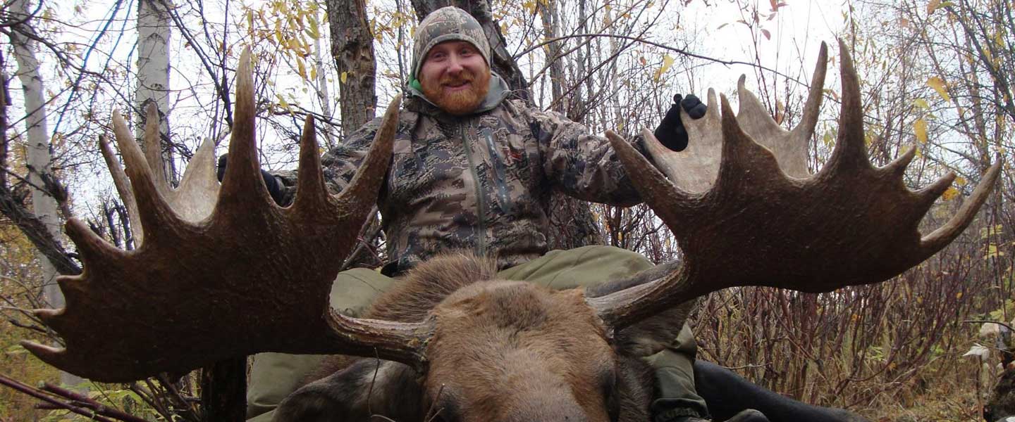 Moose hunter with moose