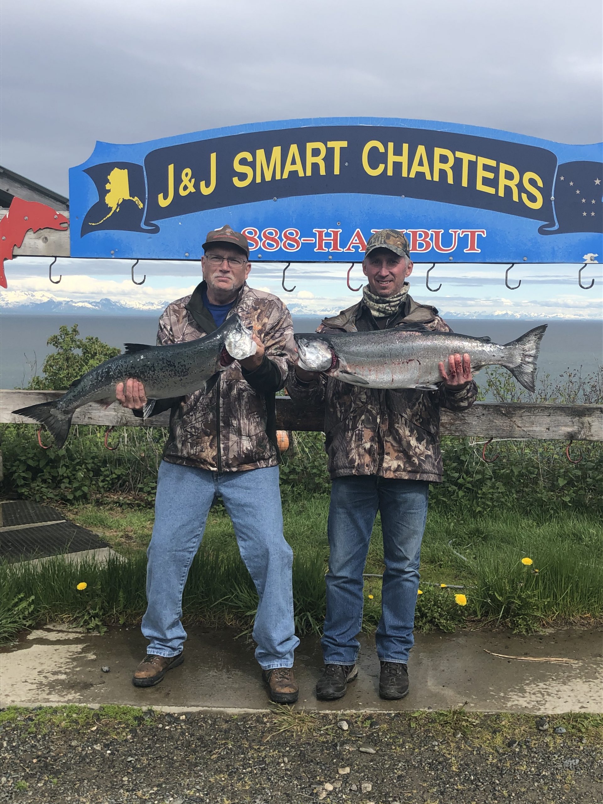 Larry and Mark holding salmon