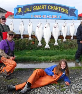 Stowell and Weigel Parties posing with their catch